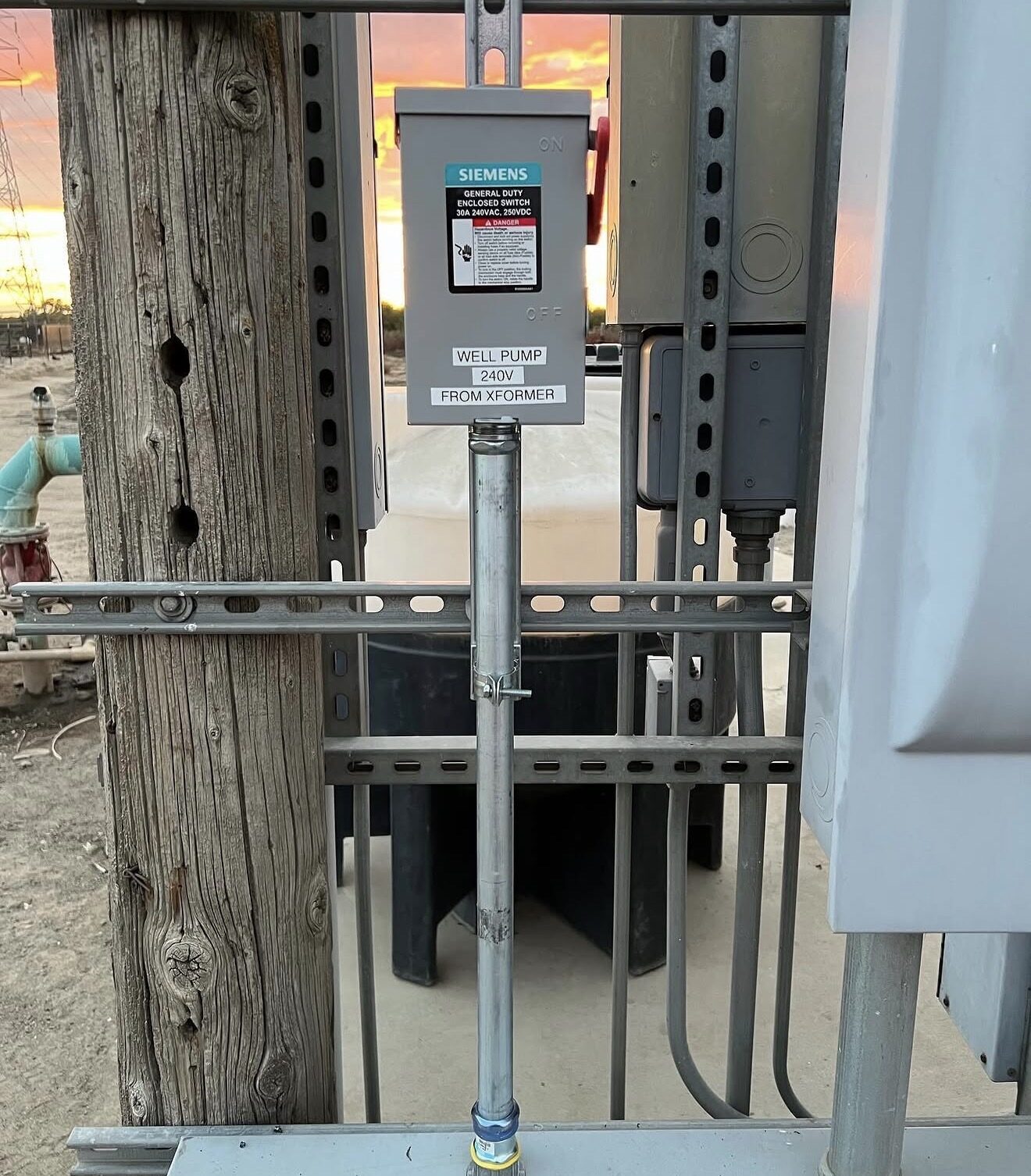 Siemens 30A enclosed safety switch labeled WELL PUMP 240V FROM XFORMER — Cyber Electric LLC