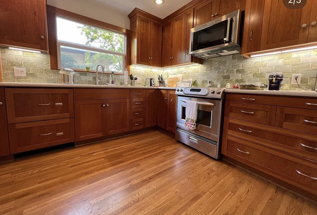 Close angle of kitchen under-cabinet LED lighting and recessed light detail — Cyber Electric LLC
