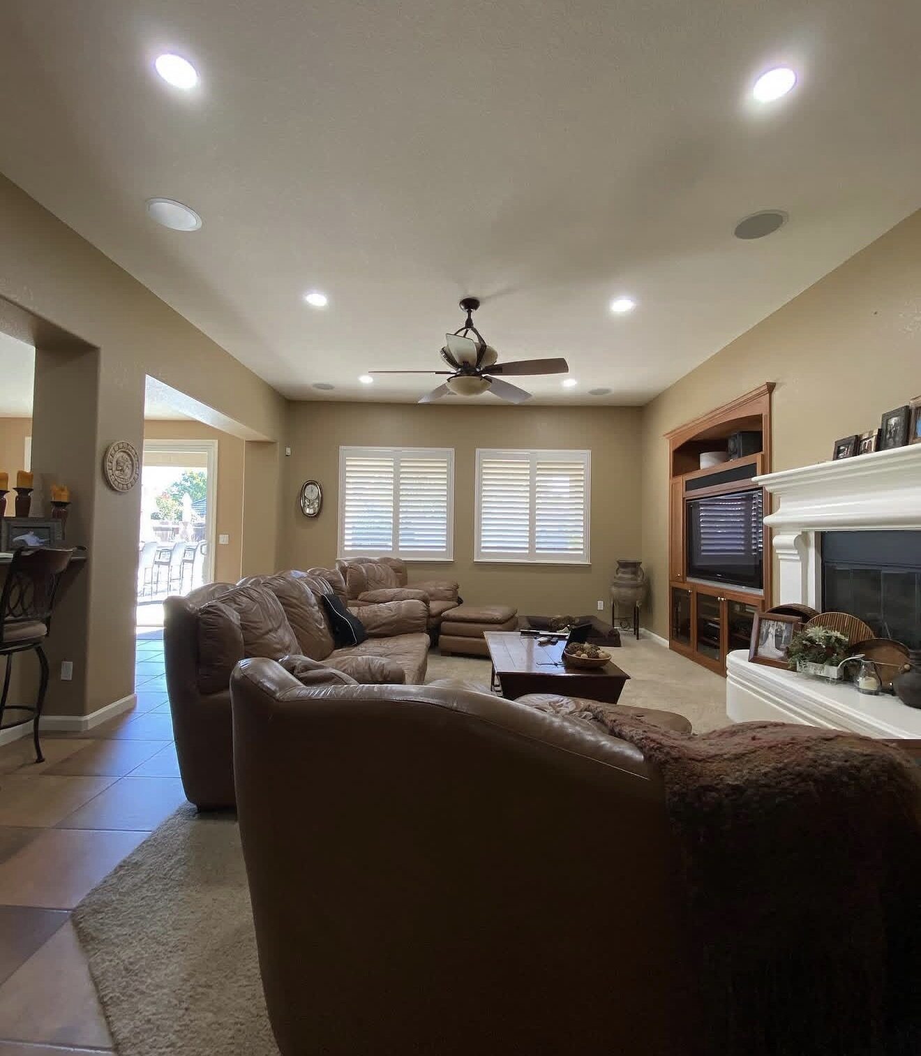 Living room with new recessed LED lighting, ceiling fan, and in-ceiling speakers — Cyber Electric LLC, Modesto CA