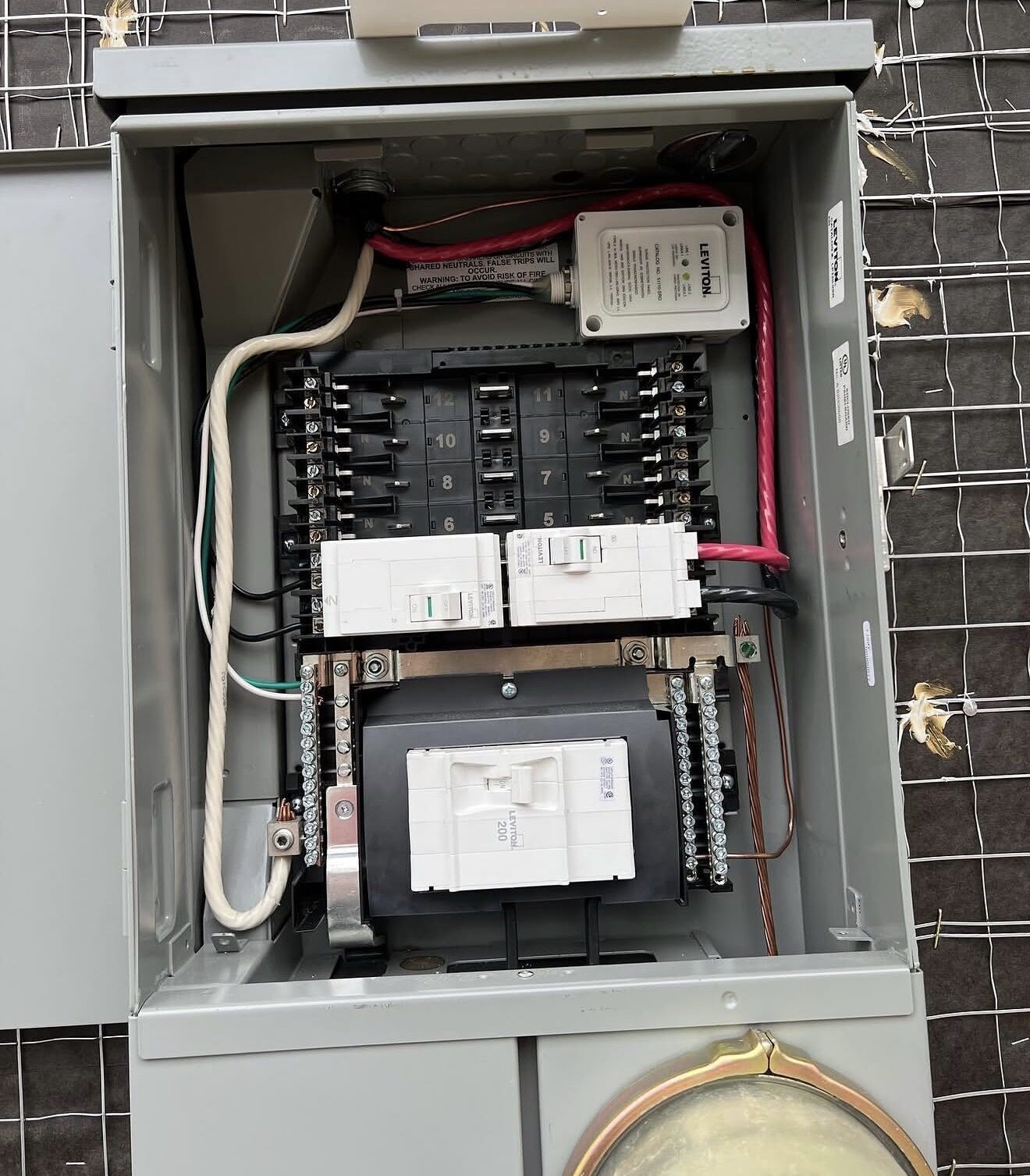 Interior close-up of Leviton panel with AFCI breakers and main disconnect — Cyber Electric LLC
