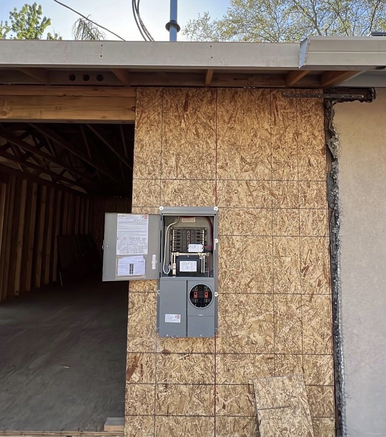 New Leviton 200A main panel and meter combo mounted on OSB wall of home addition — Cyber Electric LLC, Modesto CA