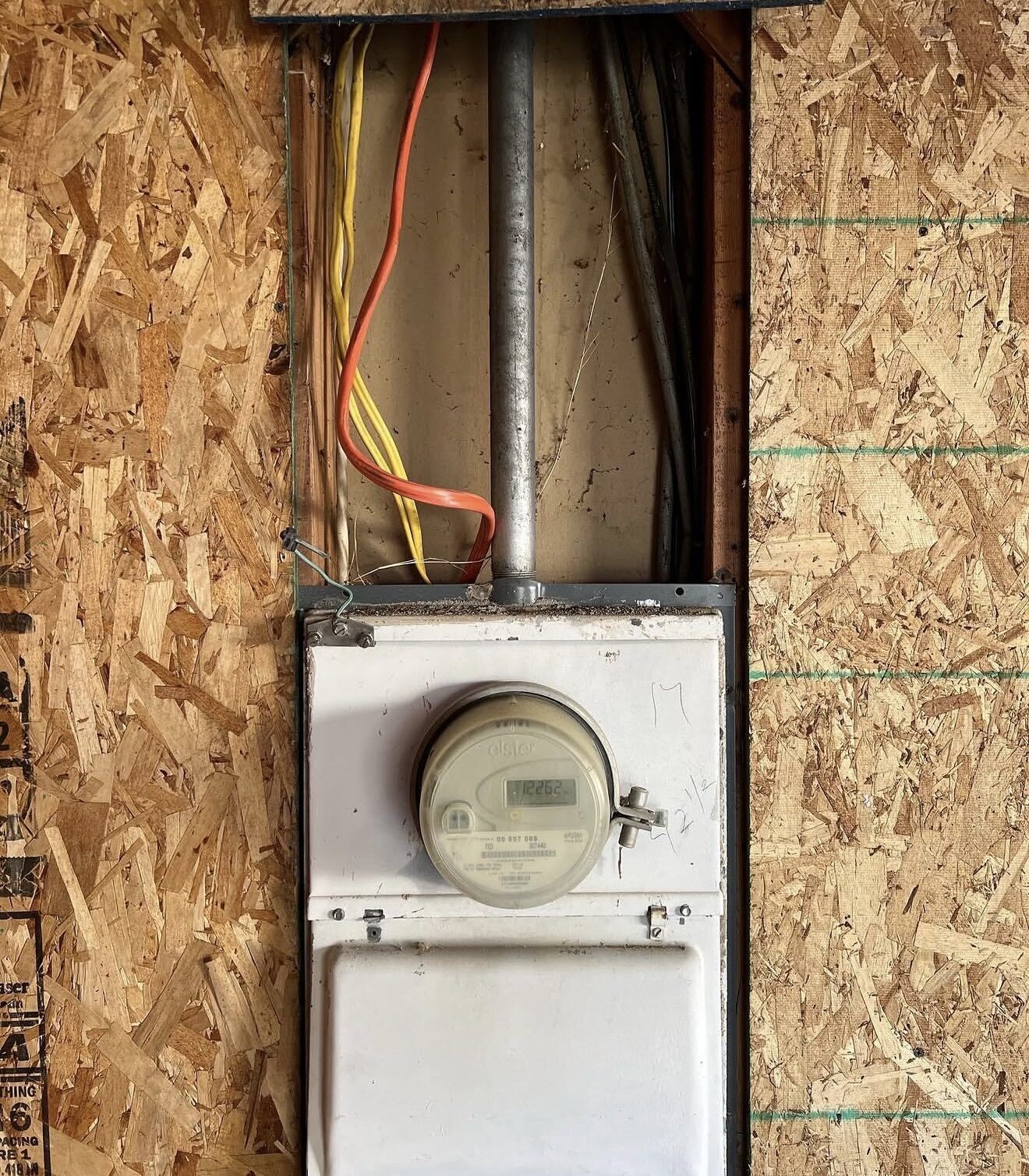 Meter socket rough-in with conduit and feeder conductors in wall opening — Cyber Electric LLC