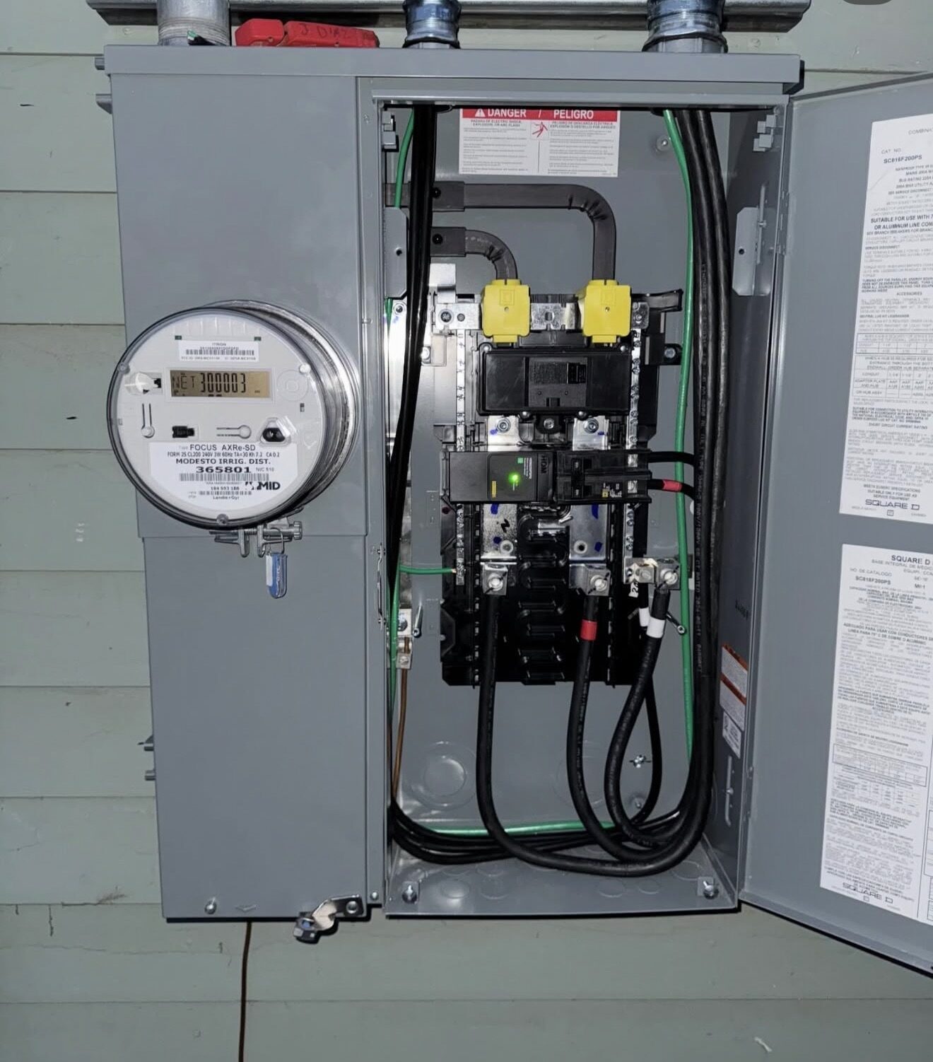 Square D meter-main combo interior with MID meter, main breaker and clean conductor routing — Cyber Electric LLC