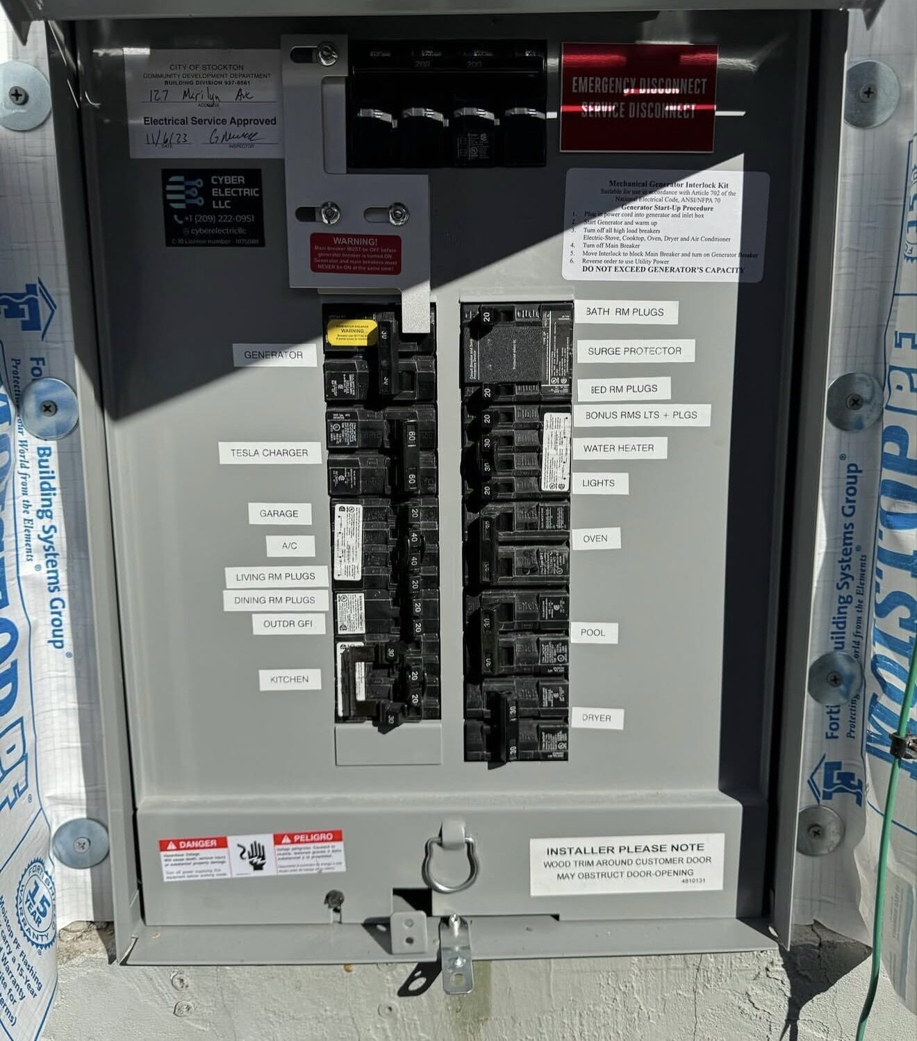Completed breaker directory with generator interlock kit, labeled circuits including Tesla charger, A/C, pool, oven — Cyber Electric LLC